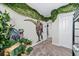 Dinosaur mural in a bedroom with large dinosaur figures at 2763 Oxymoron Way, Kissimmee, FL 34746