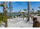 Relaxing hammock area with white sand and waterfront views at 2763 Oxymoron Way, Kissimmee, FL 34746