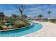 Resort-style lazy river with a surrounding landscape at 2763 Oxymoron Way, Kissimmee, FL 34746