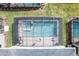 Aerial view of a screened-in pool and hot tub at 2763 Oxymoron Way, Kissimmee, FL 34746