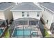Aerial view of a house with a screened-in pool and hot tub at 2763 Oxymoron Way, Kissimmee, FL 34746