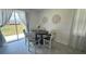 Kitchen dining area with table and chairs near sliding glass doors at 3203 Laurent Loop, Davenport, FL 33837
