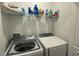 Laundry room with washer, dryer, and shelving for storage at 3203 Laurent Loop, Davenport, FL 33837