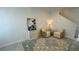 Living area with two armchairs, side table, and patterned rug at 3203 Laurent Loop, Davenport, FL 33837