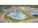 Community pool and playground, surrounded by townhouses at 3207 Laurent Loop, Davenport, FL 33837