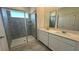 Bathroom boasts double vanity, a shower, and modern fixtures at 3207 Laurent Loop, Davenport, FL 33837