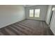 Well-lit bedroom with carpet flooring and access to a bathroom at 3207 Laurent Loop, Davenport, FL 33837