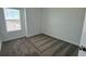Simple bedroom with gray carpeting, a window, and neutral walls at 3207 Laurent Loop, Davenport, FL 33837
