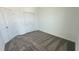 Spacious bedroom featuring carpeted floors and ample closet space at 3207 Laurent Loop, Davenport, FL 33837