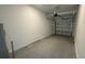 Attached garage with overhead door and white block walls at 3207 Laurent Loop, Davenport, FL 33837