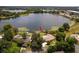 Aerial view of property highlighting lakefront location, pool, and mature landscaping at 3651 S Rosalind Ave, Orlando, FL 32806