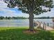 Beautiful lake view under a large tree in this grassy backyard at 3651 S Rosalind Ave, Orlando, FL 32806