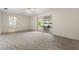 Open-concept living room leads to an outdoor patio with views of the lake at 3651 S Rosalind Ave, Orlando, FL 32806