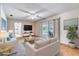 Brightly staged living room with contemporary furniture and sliding glass doors to the patio at 3651 S Rosalind Ave, Orlando, FL 32806