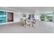 Enclosed patio featuring a dining area, grill, and access to the backyard at 3651 S Rosalind Ave, Orlando, FL 32806