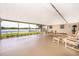 Enclosed patio with lake views, offering comfortable seating and lots of natural light at 3651 S Rosalind Ave, Orlando, FL 32806