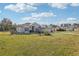 House exterior view, showcasing a spacious lawn at 5372 Sw 109Th Place Rd, Ocala, FL 34476