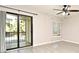 Living room with tile floors, ceiling fan and sliding glass door to balcony at 610 Cranes Way # 307, Altamonte Springs, FL 32701