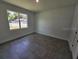 Bright, clean bedroom with tile floors and large window letting in natural light at 0 Robinson Dr, Haines City, FL 33844
