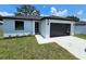 Charming single-story home featuring modern design elements and well-manicured lawn at 0 Robinson Dr, Haines City, FL 33844