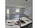 Open-concept kitchen with island and quartz counters that overlooks the living area at 0 Robinson Dr, Haines City, FL 33844