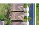 Directly above view of two homes with tile roofs at 10713 Berry Creek Rd, Orlando, FL 32836