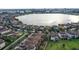 Luxury homes surrounding a large lake at 10713 Berry Creek Rd, Orlando, FL 32836