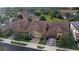 Aerial view of three homes with tile roofs in a community at 10713 Berry Creek Rd, Orlando, FL 32836