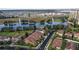 Aerial view of home near lake and high rise building at 10713 Berry Creek Rd, Orlando, FL 32836