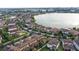 Aerial view of lakefront community with numerous homes at 10713 Berry Creek Rd, Orlando, FL 32836