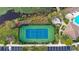 Community tennis court and pool with lake views at 10713 Berry Creek Rd, Orlando, FL 32836
