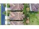 Directly above view of two homes with tile roofs at 10713 Berry Creek Rd, Orlando, FL 32836