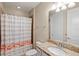Bright bathroom featuring a flamingo-themed shower curtain and granite vanity at 10713 Berry Creek Rd, Orlando, FL 32836