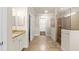 Elegant bathroom with a large shower and granite vanity at 10713 Berry Creek Rd, Orlando, FL 32836