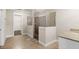 Bathroom with a large shower and granite vanity at 10713 Berry Creek Rd, Orlando, FL 32836