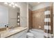 Full bathroom with tub shower combination and granite vanity at 10713 Berry Creek Rd, Orlando, FL 32836