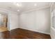 Bright bedroom with hardwood floors and access to bathroom at 10713 Berry Creek Rd, Orlando, FL 32836