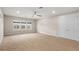 Spacious bedroom with ample natural light and carpet flooring at 10713 Berry Creek Rd, Orlando, FL 32836