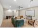 Spacious bonus room featuring a ceiling fan and projection screen for entertainment at 10713 Berry Creek Rd, Orlando, FL 32836