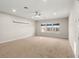 Bright bonus room featuring large windows and ceiling fan at 10713 Berry Creek Rd, Orlando, FL 32836