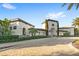 Inviting community entrance with a Mediterranean-style building at 10713 Berry Creek Rd, Orlando, FL 32836