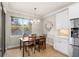 Kitchen dining area with a table and chairs, and large window at 10713 Berry Creek Rd, Orlando, FL 32836