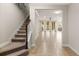 Spacious foyer with tile floors, staircase, and an open view to the living area at 10713 Berry Creek Rd, Orlando, FL 32836