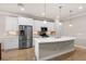 Modern kitchen with stainless steel appliances and an island at 10713 Berry Creek Rd, Orlando, FL 32836