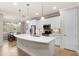 Modern kitchen with stainless steel appliances and an island at 10713 Berry Creek Rd, Orlando, FL 32836