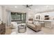 Stylish living room showcasing an open layout to the kitchen with modern finishes at 10713 Berry Creek Rd, Orlando, FL 32836