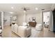 Inviting living room with elegant decor, flowing into dining area and other rooms at 10713 Berry Creek Rd, Orlando, FL 32836