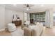 Cozy living room features a modern aesthetic and access to an outdoor living space at 10713 Berry Creek Rd, Orlando, FL 32836