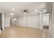Bright, airy living room with tile floors and ceiling fan at 10713 Berry Creek Rd, Orlando, FL 32836
