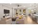 Spacious living room with tile floors and stylish furnishings at 10713 Berry Creek Rd, Orlando, FL 32836